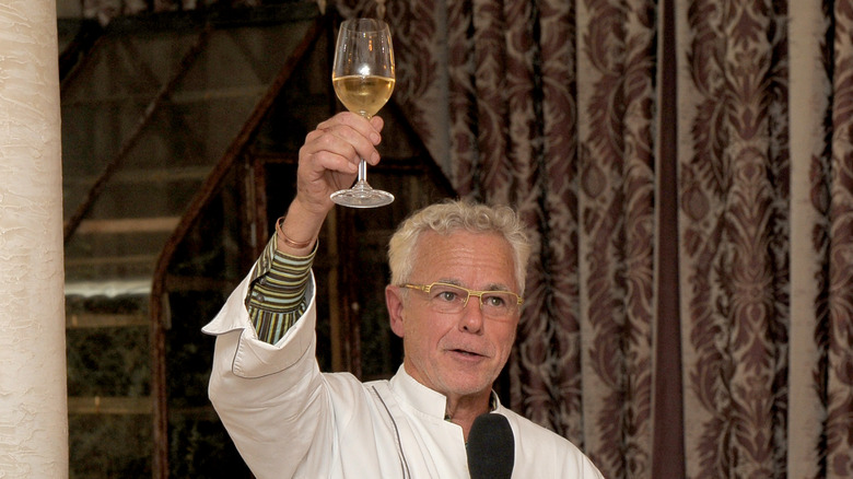 David Bouley raising a wine glass. 