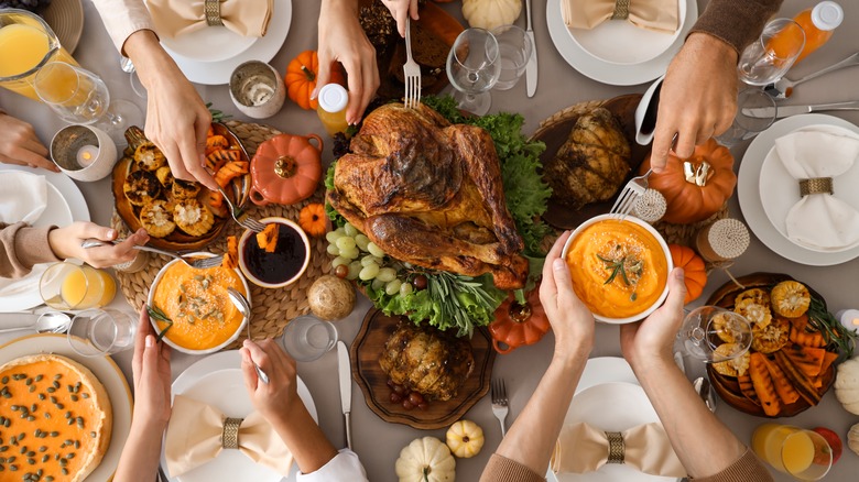 Thanksgiving table with hands