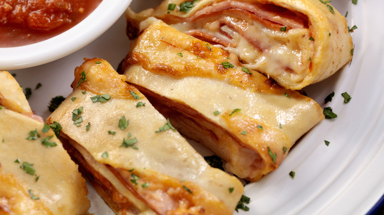 stromboli slices on white plate