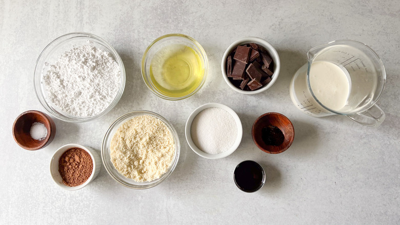 chocolate macaron ingredients in bowls on table