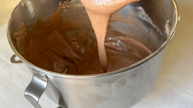 Chocolate macaron batter in mixer bowl