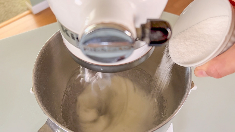 Adding sugar to whipped egg whites in mixer