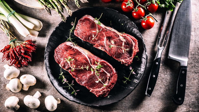 Two raw steaks displayed side by side.
