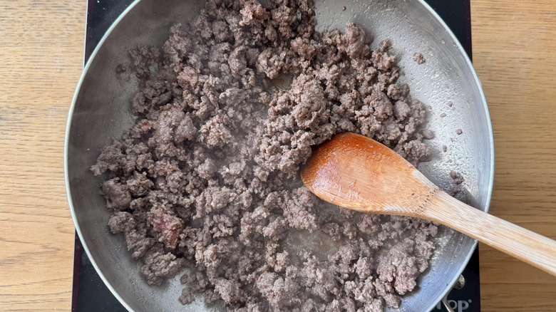 Ground beef cooking in skillet