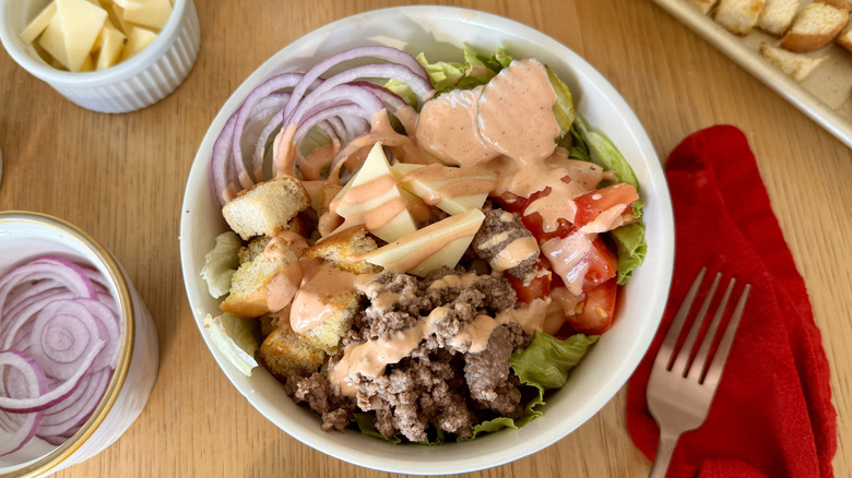 Cheeseburger bowls topped with special sauce