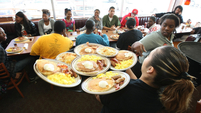 Denny's waitress serving Grand Slam breakfasts