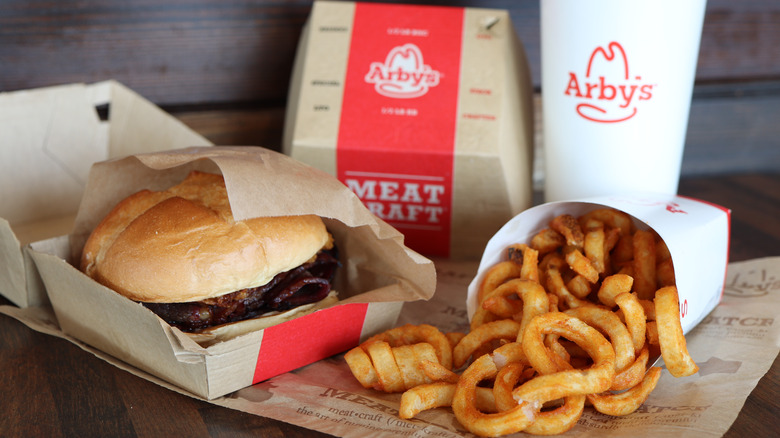 Arby's meal with a burger and curly fries