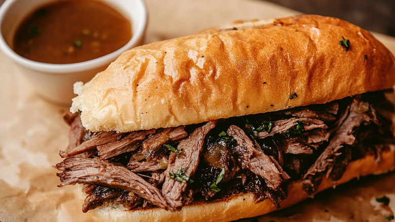 French dip on parchment with jus