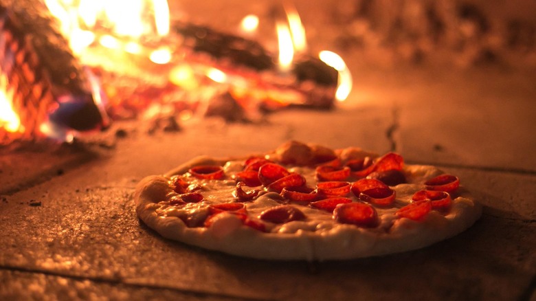 Pizza inside woodfire stove