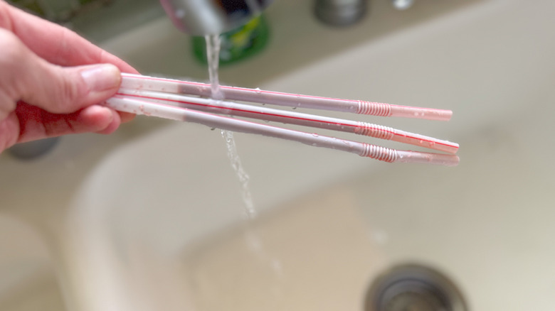 rinsing straws under sink