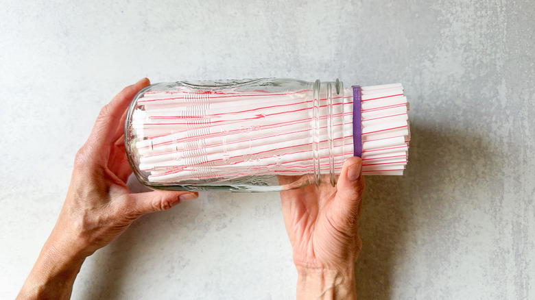 bundled straws in glass jar