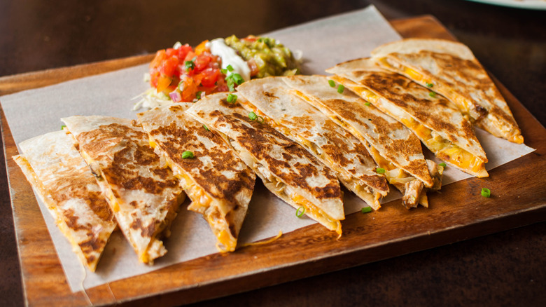 a row of chicken and cheese quesadilla slices