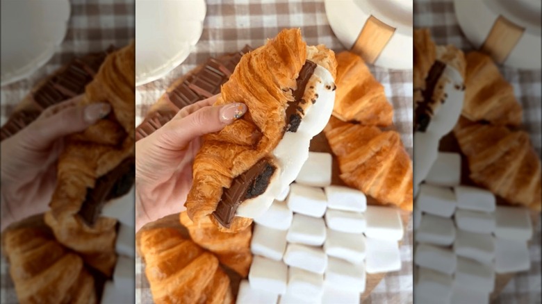 Person holding a croissant s'more