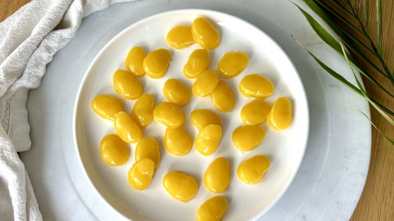 mango candies on white plate