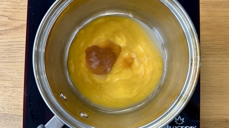 pureed mangoes in metal pot