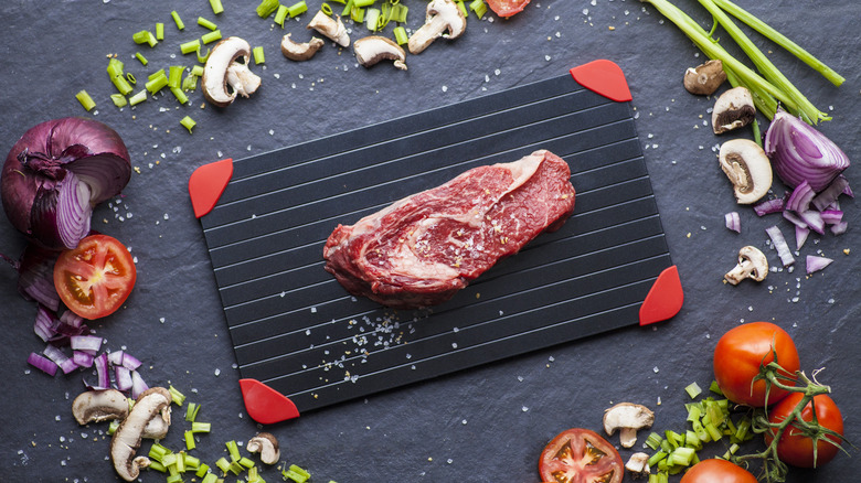 a steak on a defrosting tray