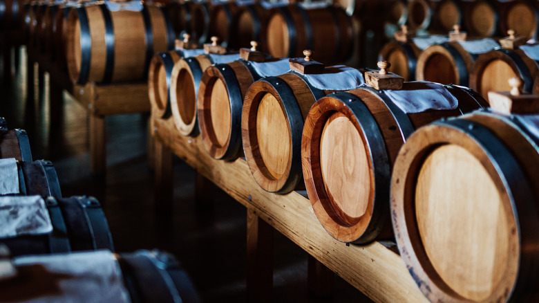 Balsamic vinegar aging barrels stacked in a row in Modena, Italy