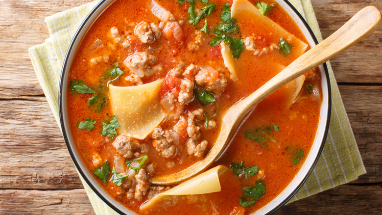 bowl of soup with ground meat and lasagna noodles