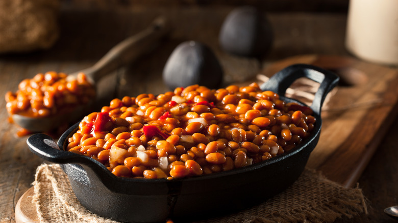 Pot of BBQ baked beans in black skillet