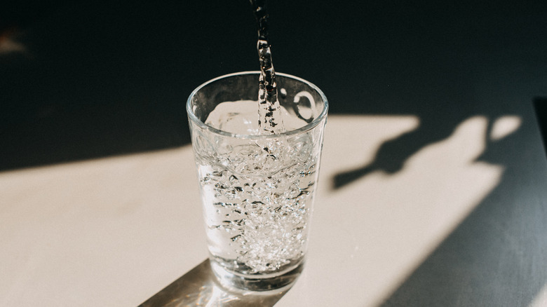 Water pouring into a glass