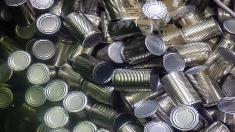 silver cans in a pile