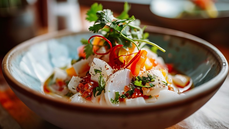 A bowl of ceviche garnished with cilantro