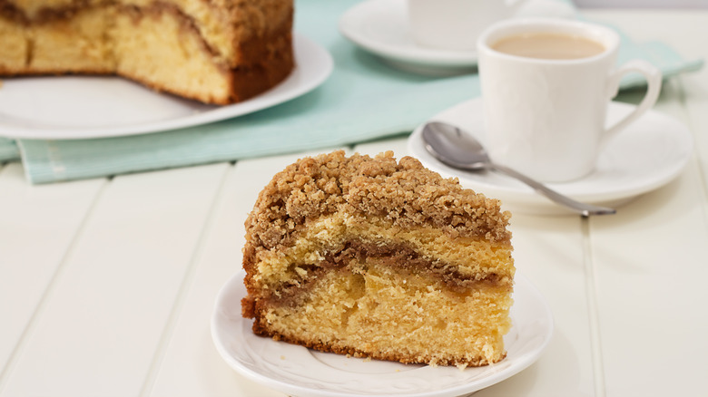 Slice of coffee cake with cup of coffee