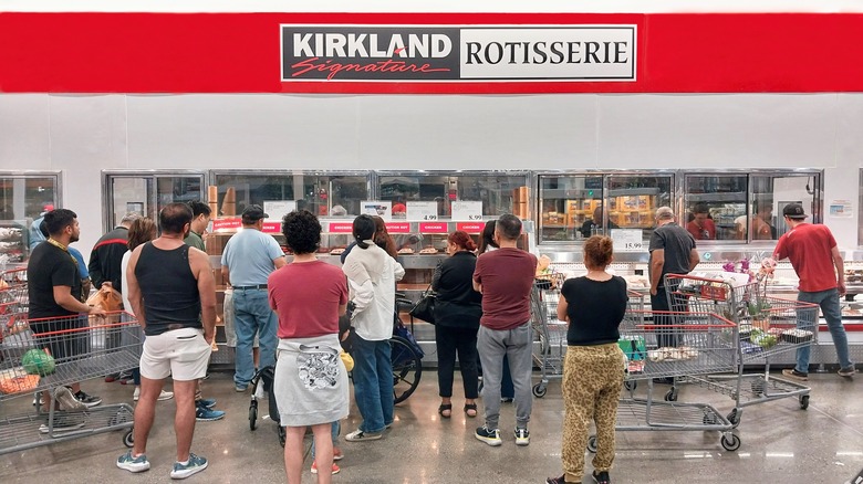 Crowd gathered around the Costco rotisserie