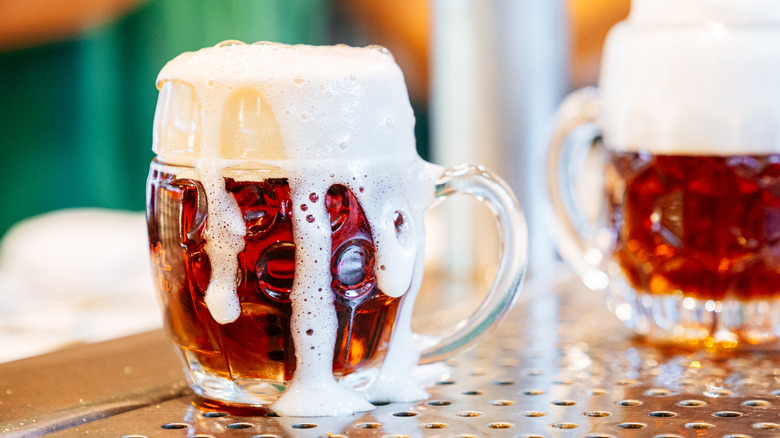 Freshly poured beer in a stein.