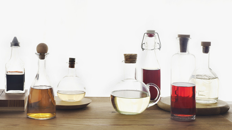 A variety of vinegars in glass bottles