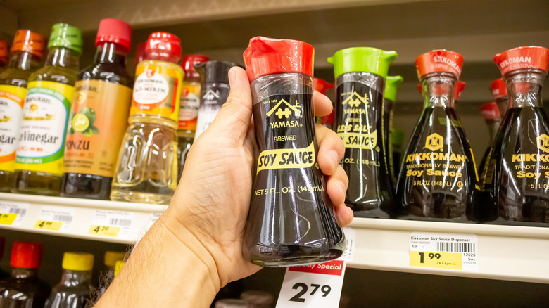 Soy sauce held in hand