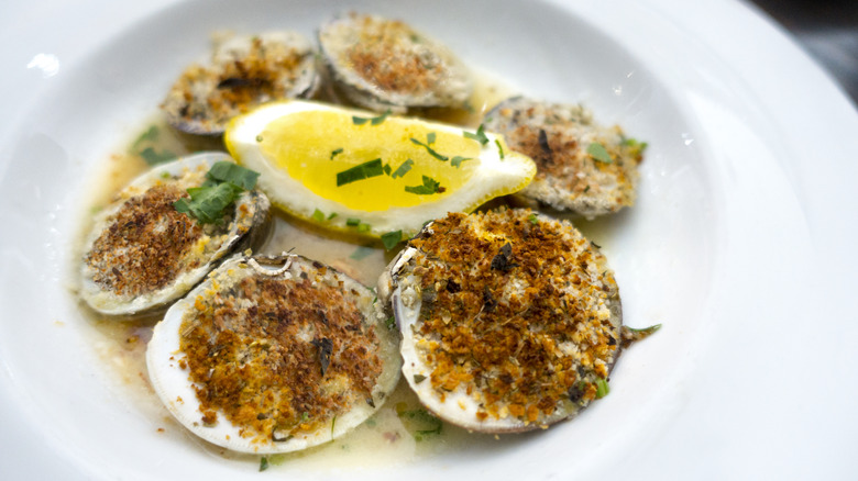 Stuffed, baked clams on a plate