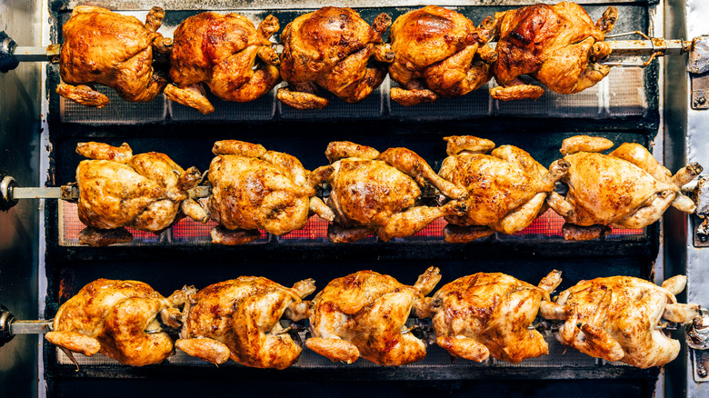 Rows of rotisserie chickens