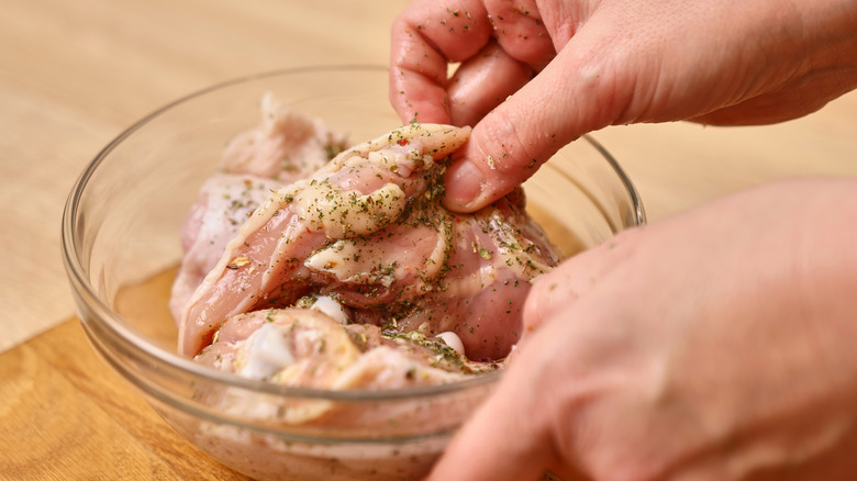 chicken breast marinating in bowl