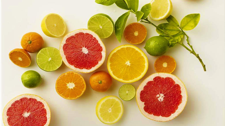 A variety of cut citrus fruit