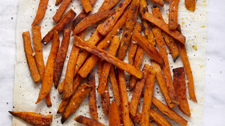 Sweet potato fries on parchment paper