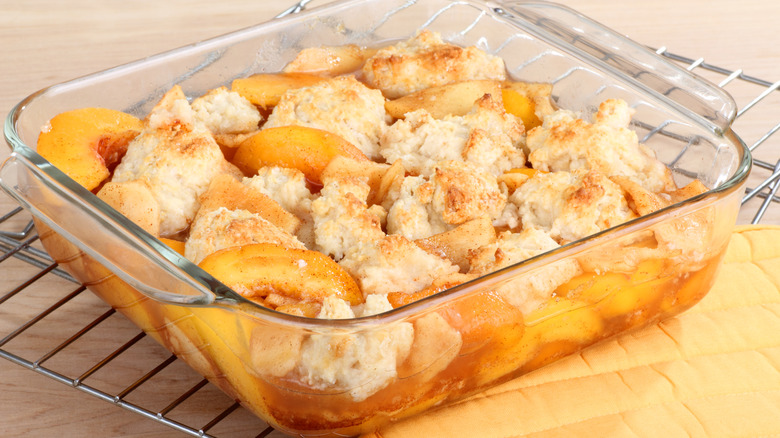 peach cobbler in baking dish