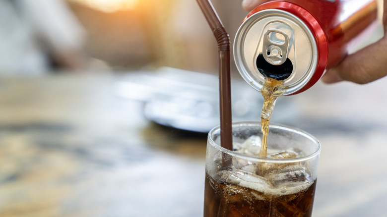 Pouring soda into a glass