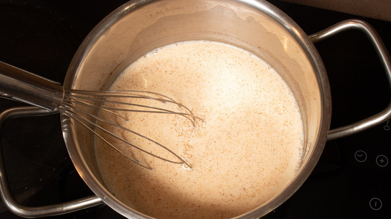 tan liquid in metal pot