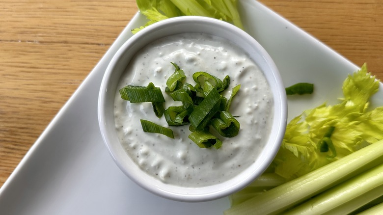 Dip in bowl with scallions
