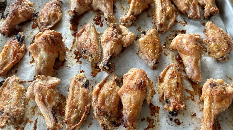 chicken wings on baking sheet