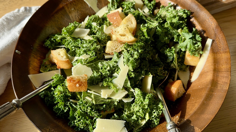 Serving bowl of kale Caesar salad