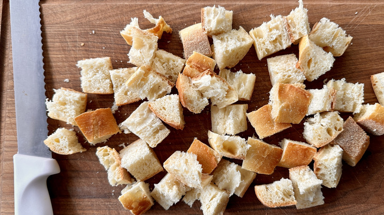 Bread cubes on baking sheet