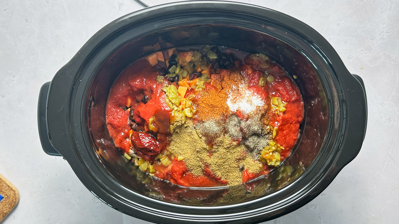 broth and spices in slow cooker