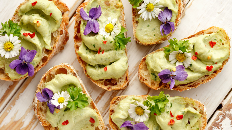 avocado toasts with edible flowers