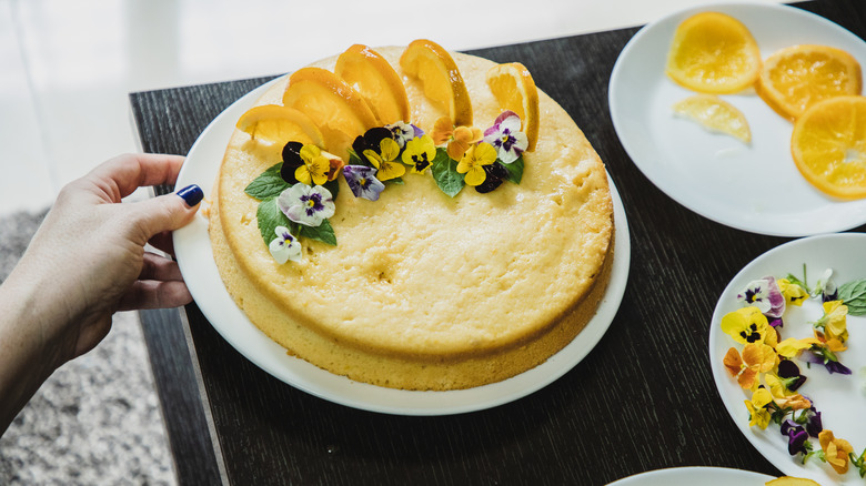 Citrus cake with edible flower decoration