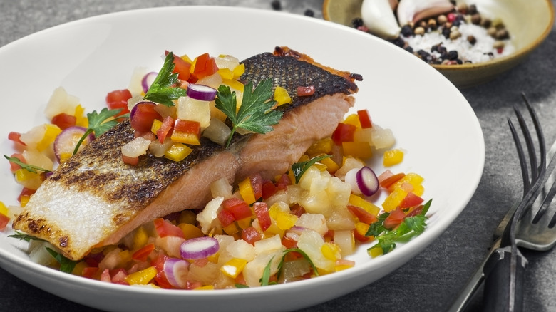 Salmon in a plate with pineapple salsa