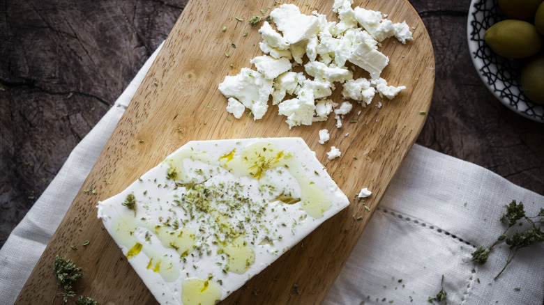 Crumbly block of feta with herbs and oil