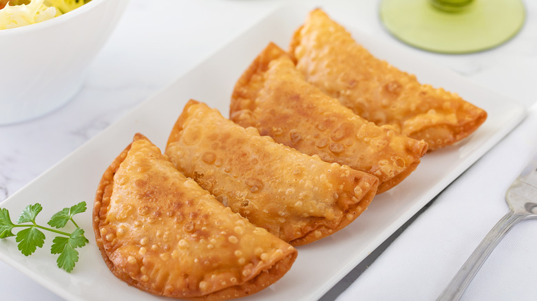 white plate of empandas