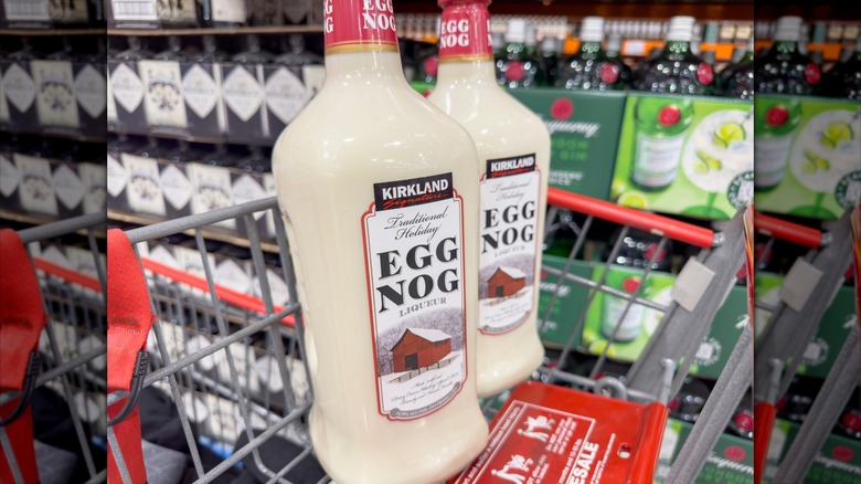 Two bottles of Kirkland Signature eggnog in a cart at Costco